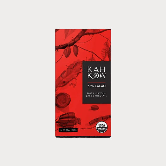 A vertical bar of Kahow 55% Cacao dark chocolate in its packaging, featuring a vibrant red background with botanical illustrations and a black label block.